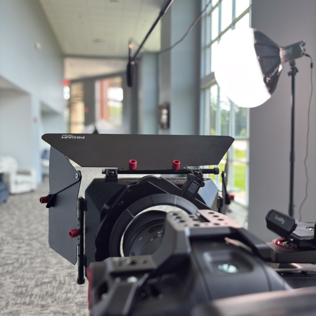 Behind-the-scenes shot of Mosslight Media's high-end video production set up with cinema camera, boom mic, and lighting equipment in Jackson, MS.